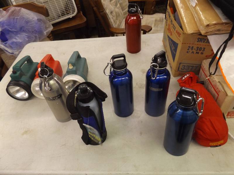 lot 629 image: Water bottles and flashlights