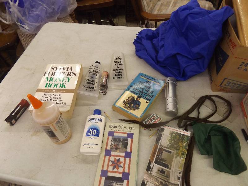 lot 630 image: Misc, book, wood glue, sunscreen, spark plugs and other misc