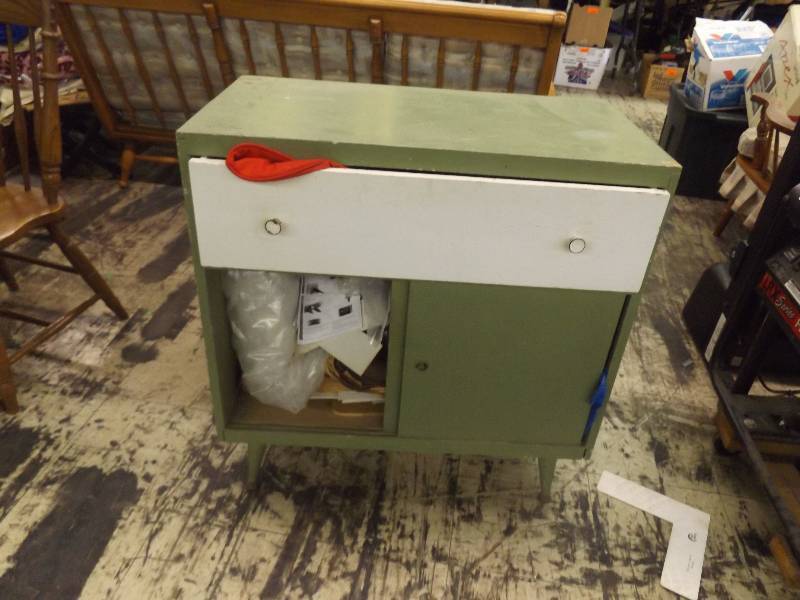 lot 662 image: Small green painted cabinet with contents