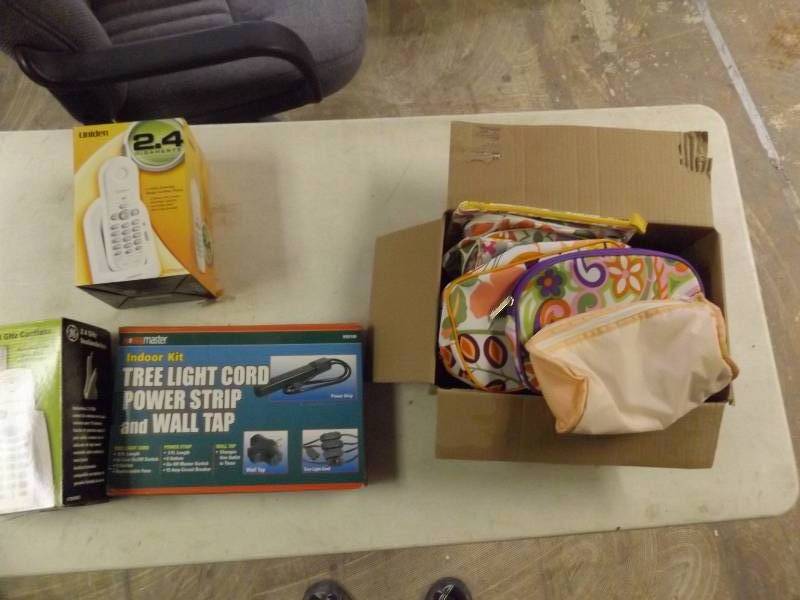 lot 710 image: GE Cordless phone, treelight cord, makeup bags