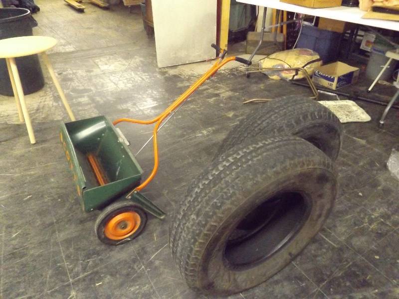 lot 769 image: 2 tires and seed spreader