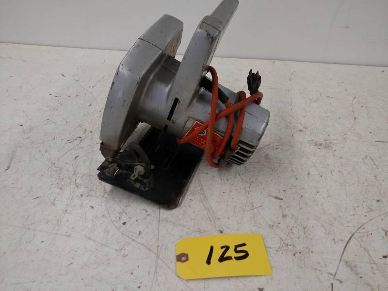 lot 125 image: Black & Decker 7 14 Utility Saw...