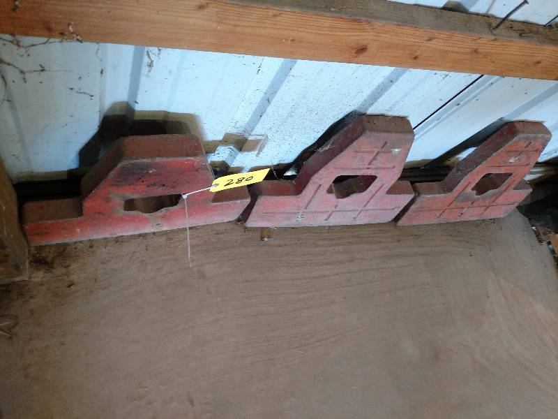 lot 280 image: (3) Cast Iron Wheel Weights...
