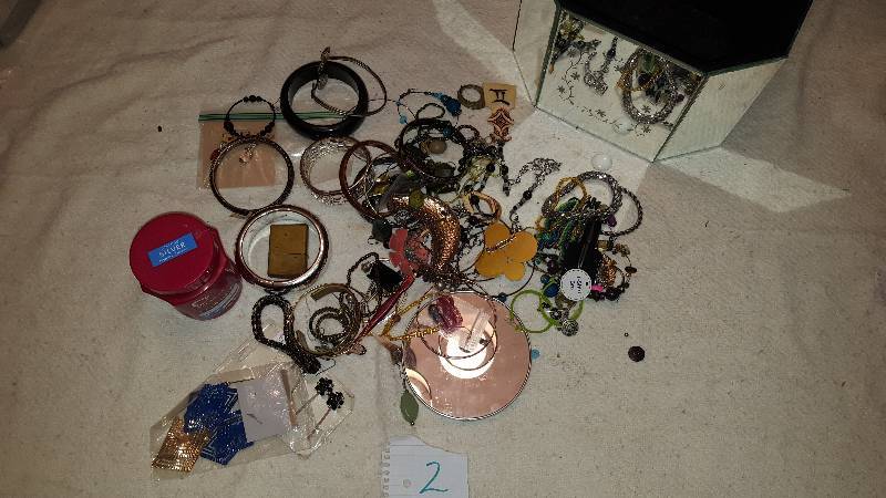 Mirrored jewelry case filled with jewelry