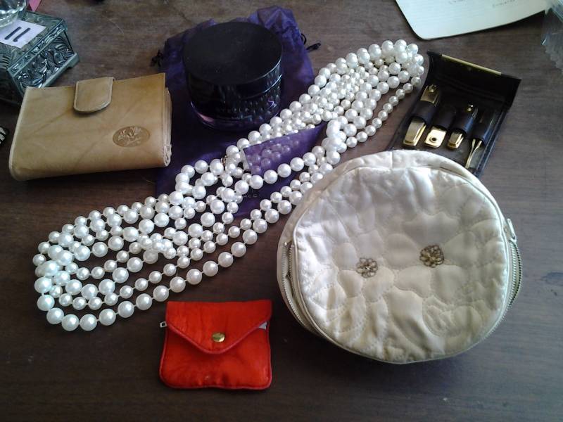 lot 12 image: Buxton Leather Ladies Wallet, Long Pearl Necklaces, Manicure Case, Stella Perfume Jar Only, Misc