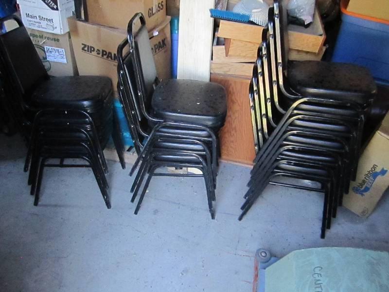 14 black stacking chairs...