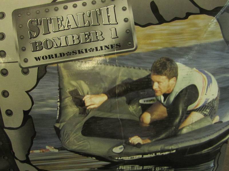 Stealth Bomber tube, half in water,...
