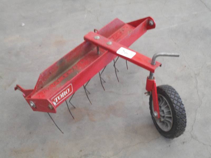 lot 56 image: Toro 21 Lawn Mower De-Thatcher Att...