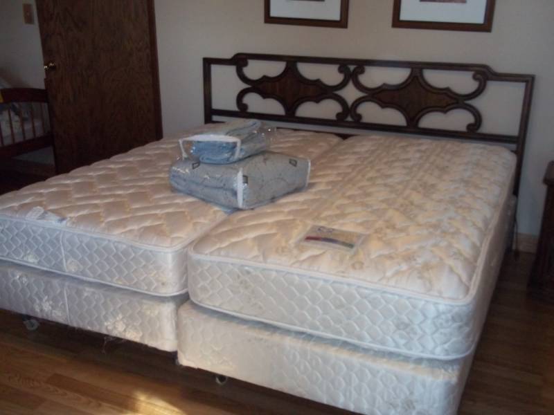 King Sized Bed Frame with Comforter and Pillow Shams.