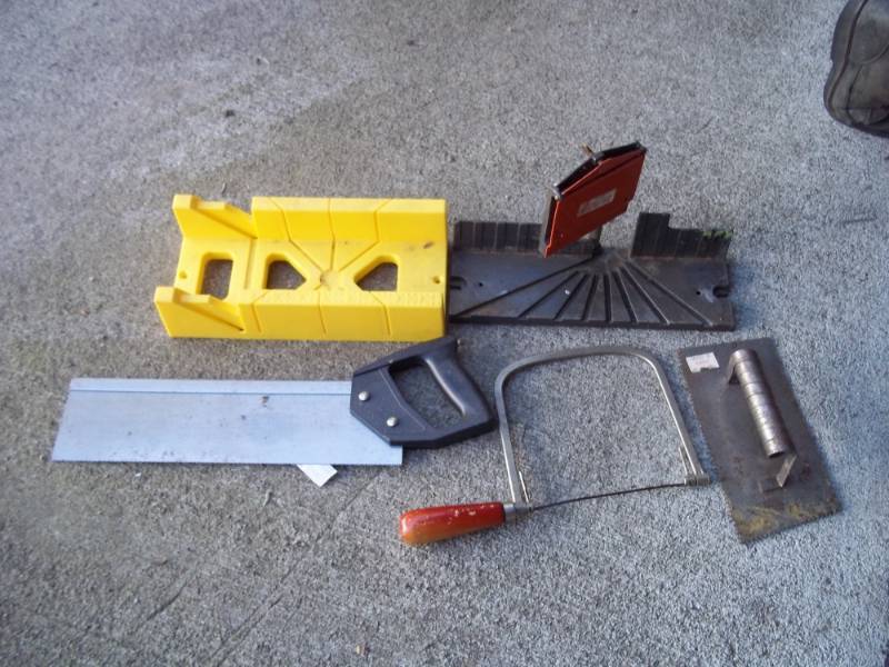Miter box with saw and coping saw with trowel