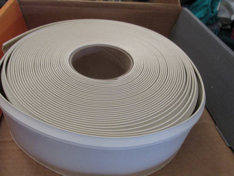lot 77 image: Roll of plactic wall base edging ...
