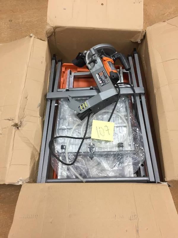 lot 107 image: Ridgid 7 in. Tile Saw with Stand in like new working conditions