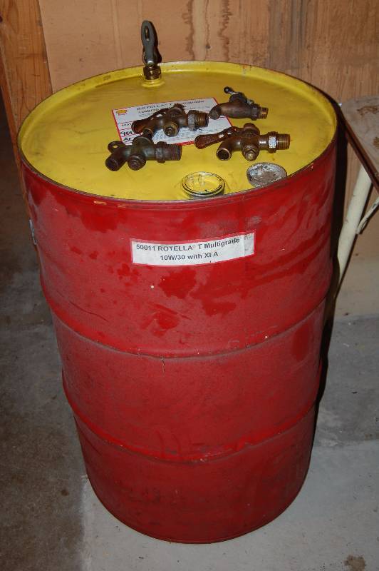 lot 802 image: Metal Barrel with Contents
