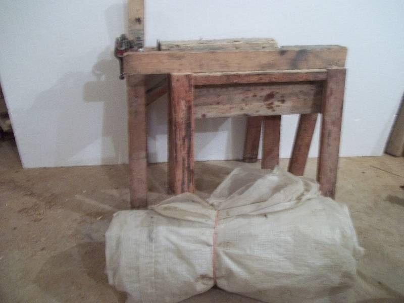 lot 908 image: Saw Horses with Pipe Vise and Large Roll of Plastic