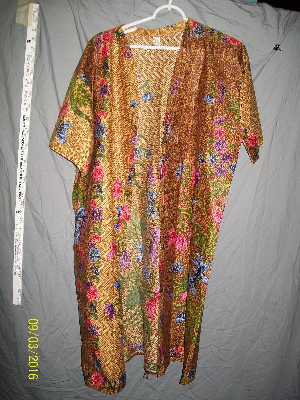 lot 14 image: Adult CostumeCotton Kimono Robe with Attached BeltTan-ish color. Unknown Size. Tag XL.