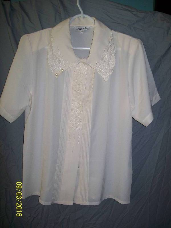lot 24 image: Adult CostumeWhite-ish ShirtBlouse Unknown Size. Tag11JIAHUADA. Hidden Button down Front.
