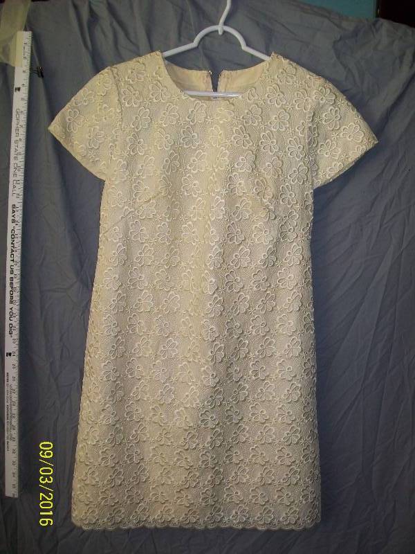 lot 25 image: Adult CostumeWhite-ish Tunic Dress. Unknown Size. No Tag. Heavy Weighted Material.