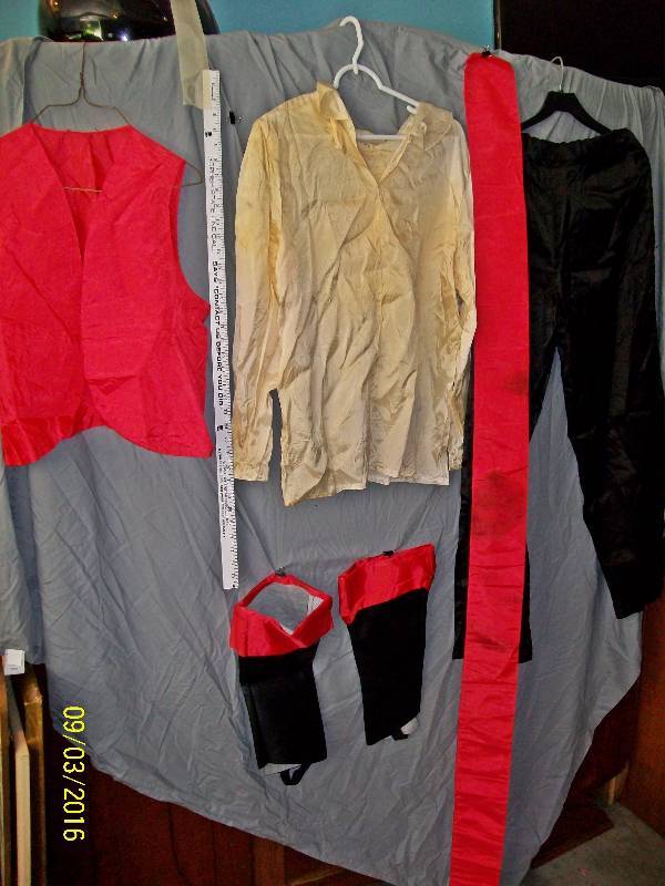 lot 30 image: Adult CostumePirate Shirt, Pants, Vest, Sash, Boot Covers. Unknown Size. No Tags