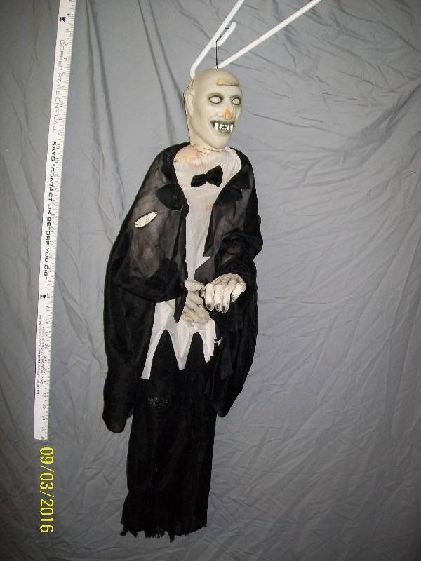 lot 49 image: YardHome Decoration. Vampire Hanger. 36 Long. Condition Previously Owned. Nose paint scuffed.