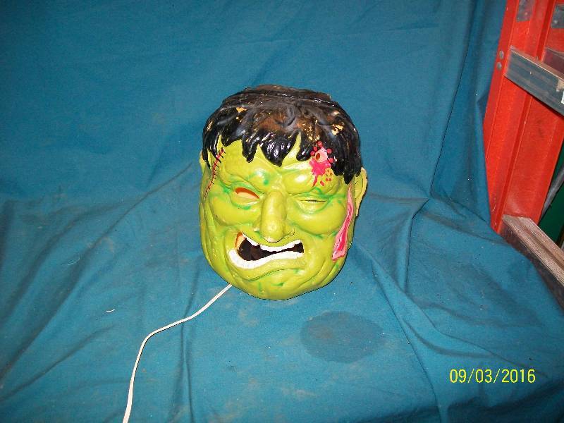 lot 50 image: YardHome Decoration.  Frankenstein Lighted Head. Condition Previously Owned. paint scuffed.