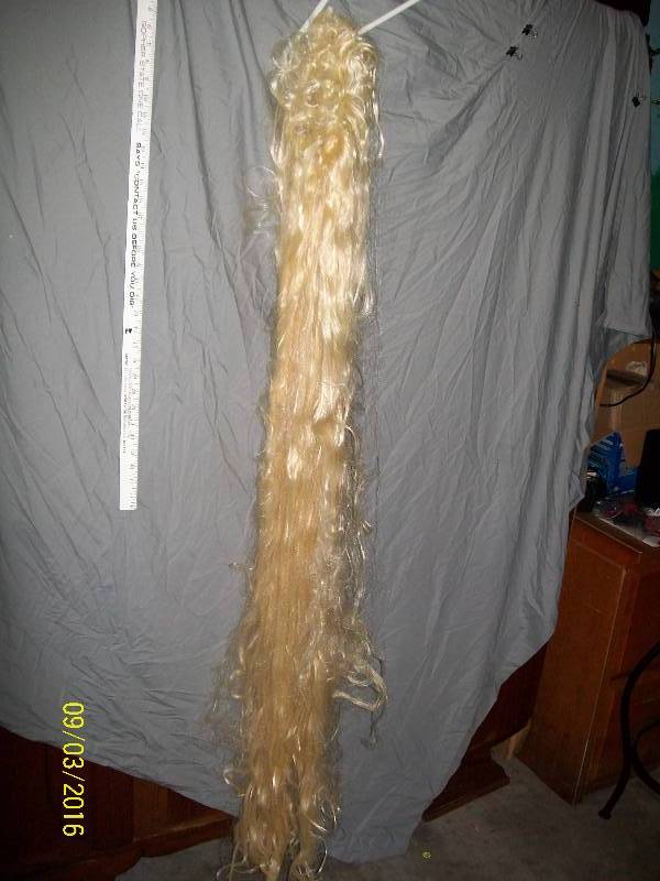 lot 53 image: KidAdult Wig. Long Blonde Wig. Approximately More Than 60 Long. ConditionPreviously Owned. Worn.