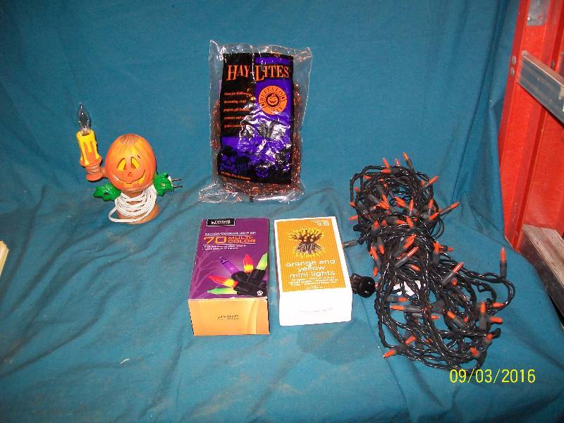 lot 54 image: DecorationLights70 Multi-Color 70 YellowOrange Hay-Lites OrangeBlack, Pumpkin candle light.