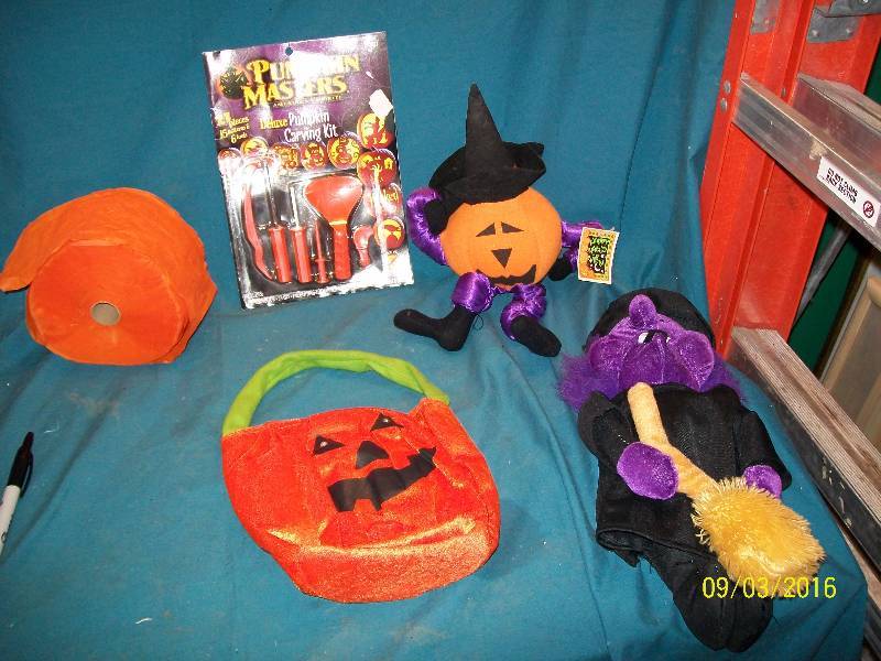 lot 55 image: Decorations Pumpkin Carving Kit. Pumpkin bag. Jack-O-Lantern. Purple Witch. Orange Crepe Paper.
