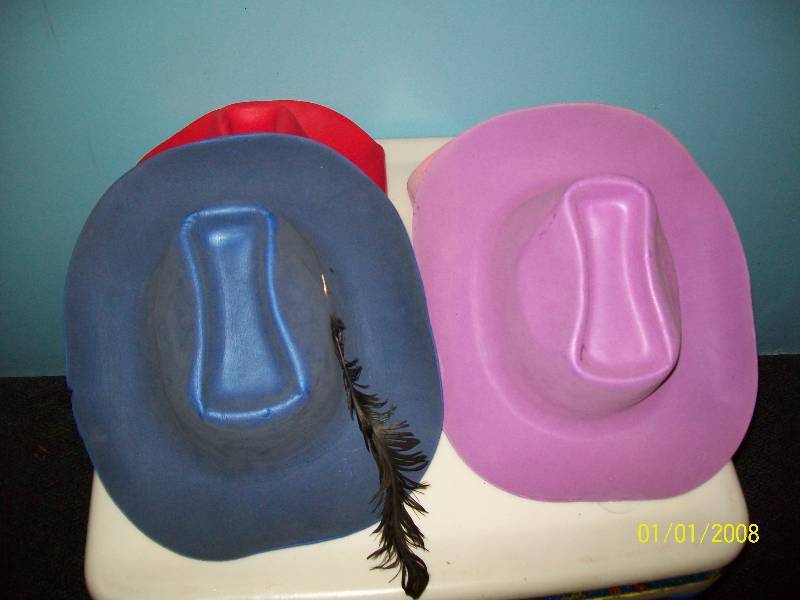 lot 78 image: Child Costume Four Different Colored Felt like Cowboy or Cowgirl Hats. Unknown Size.