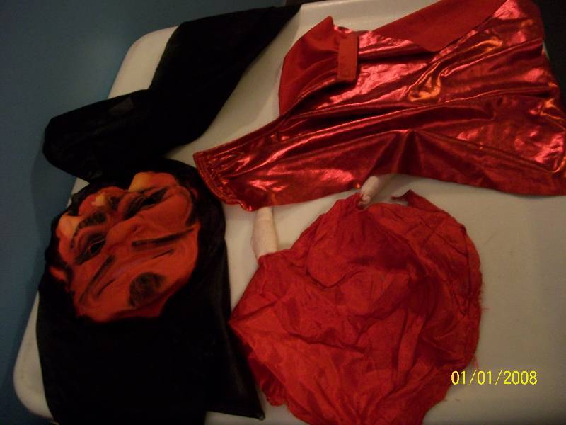 lot 71 image: AdultChild Costume Two Devils with Two Capes. Unknown Sizes.
