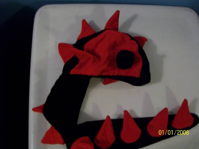 lot 72 image: Child Costume Child Skull Cap with spikes down long tail. Resembles Dragon or Dinosaur.
