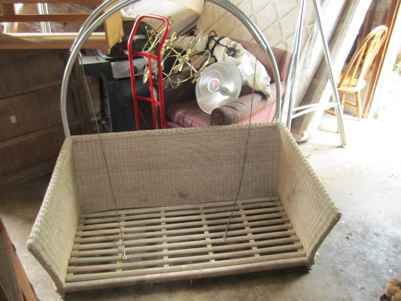 lot 52 image: Hanging wicker swing 56 wide...