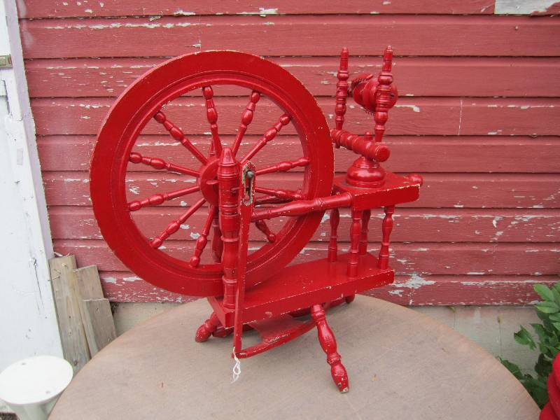 lot 55 image: Antique spinning wheel, painted red...
