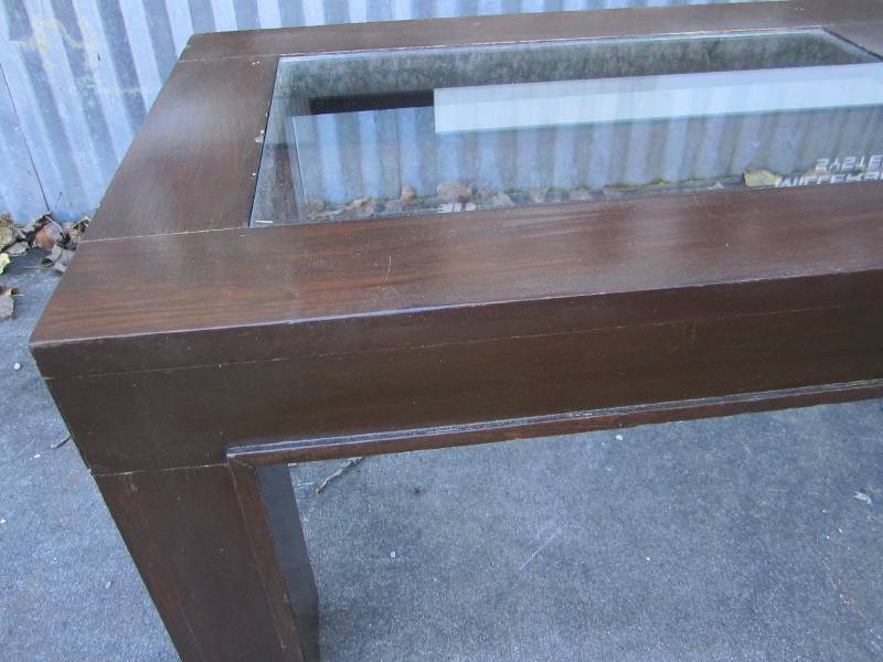 lot 105 image: Glass top coffee table, 22 x 58 to...