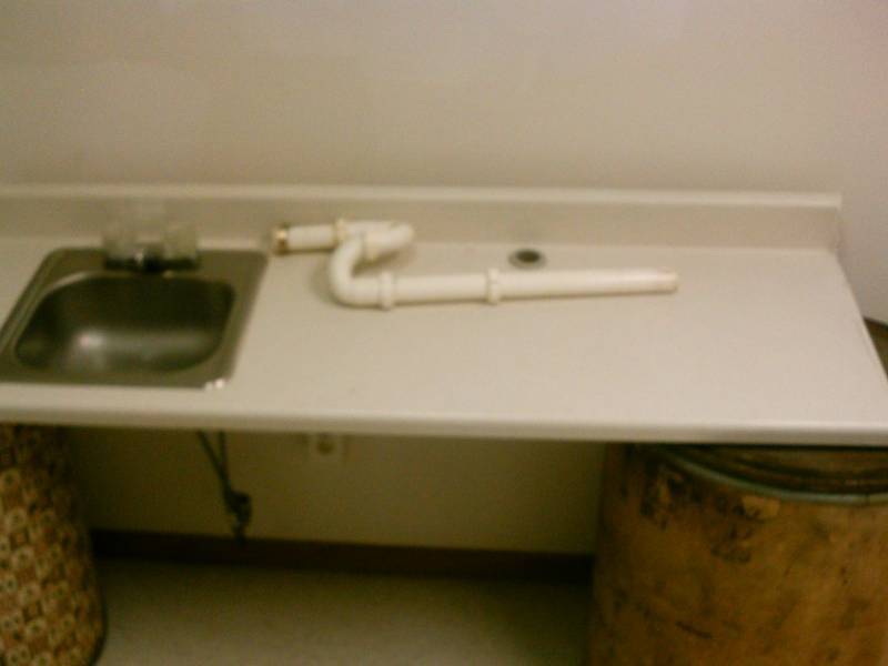 lot 35 image: Counter top, bone colored, with stainless sink