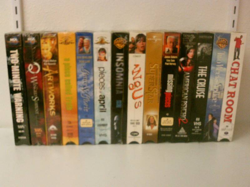 lot 61 image: VHS lot of 14 New in shrink wrap-titles include 2 weeks notice