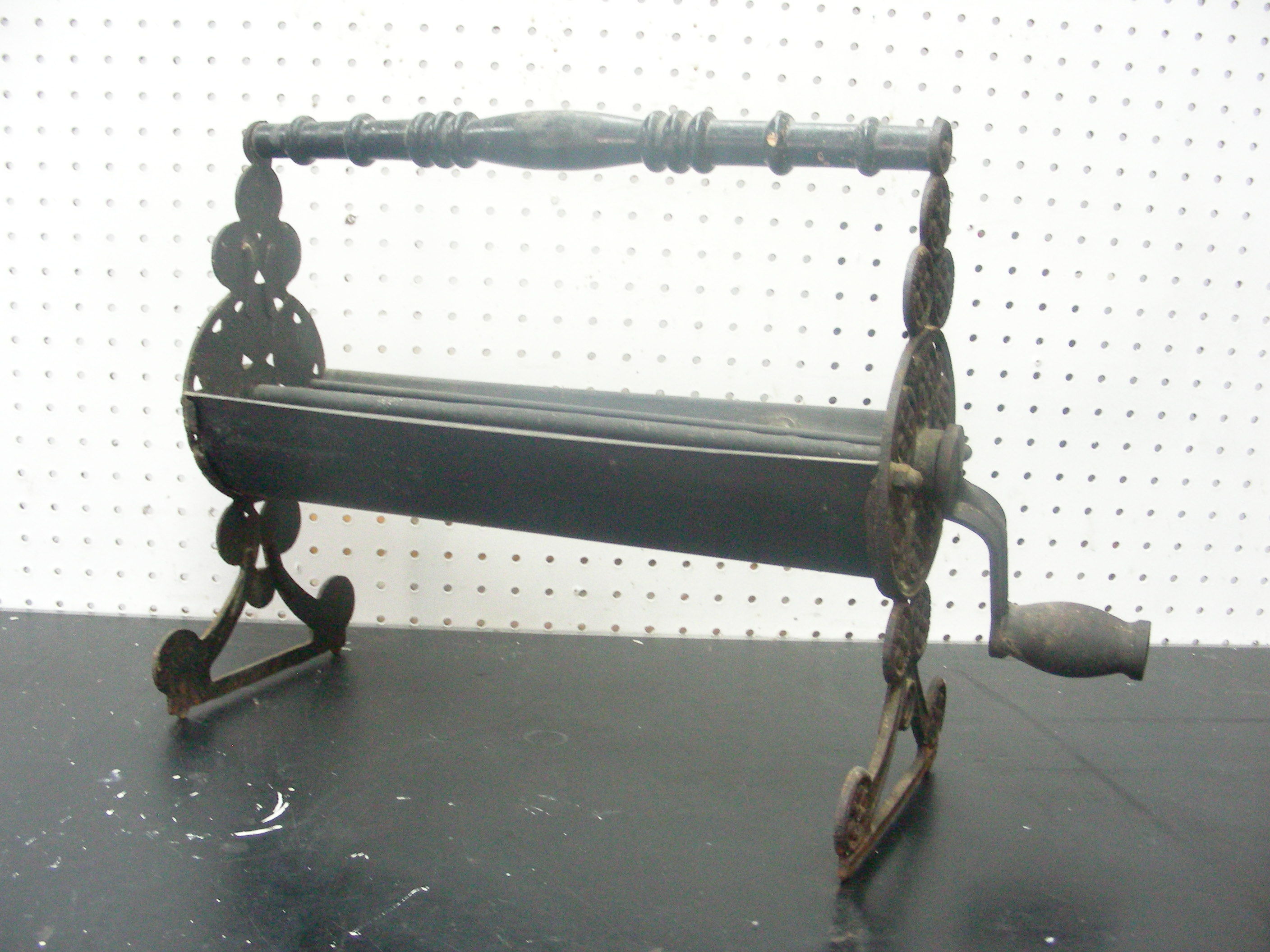 lot 11 image: Antique Cast Iron Newspaper Log Roller