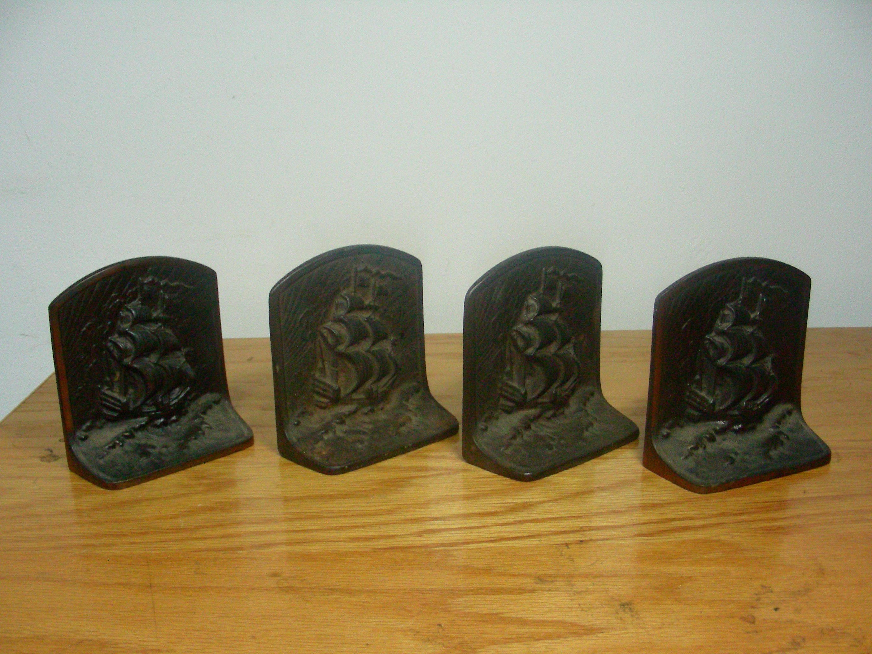 lot 36 image: 4 Heavy Cast Iron Ship Book Ends