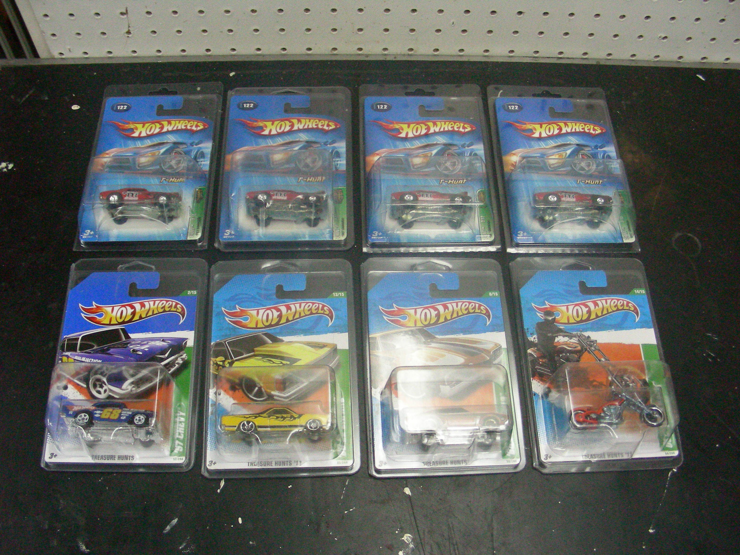 lot 44 image: 8 MINT on Card Hot Wheels Treasure Hunt Cars