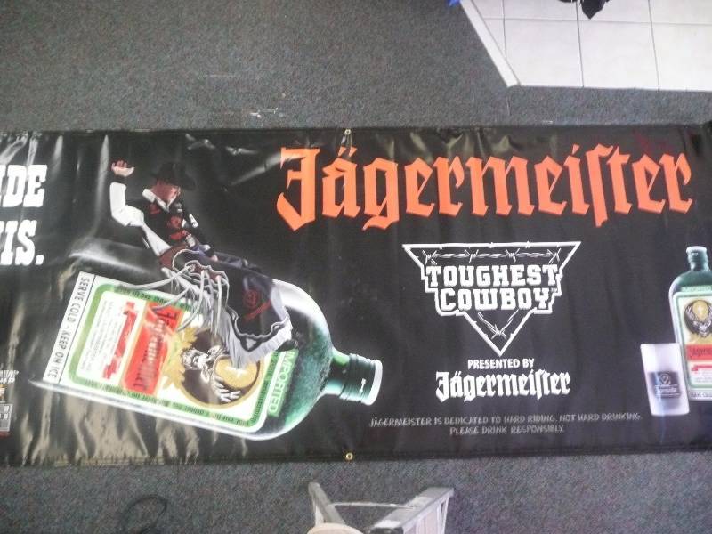 lot 36 image: Large Jaegermeister Toughest Cowboy Rodeo Banner - Approx 10ft wide by 4ft high - Very Good Condition