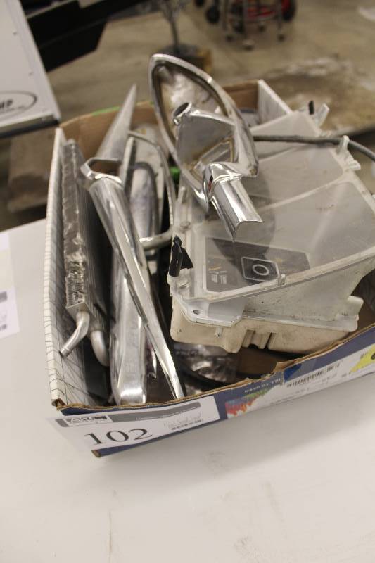lot 102 image: Lot of GM miscellaneous trim and other parts