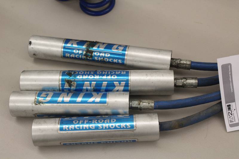 lot 74 image: Lot of (4) King Off Road Racing Shock remote reservoirs with hoses