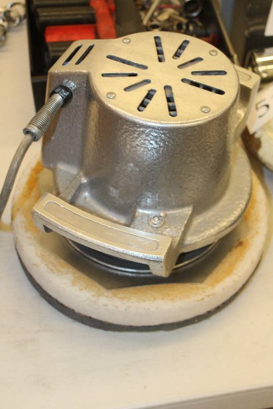 lot 45 image: Cast aluminum buffer with pads