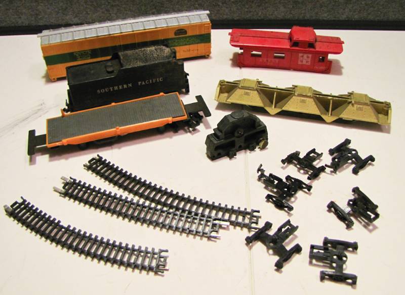lot 42 image: several train parts and pieces