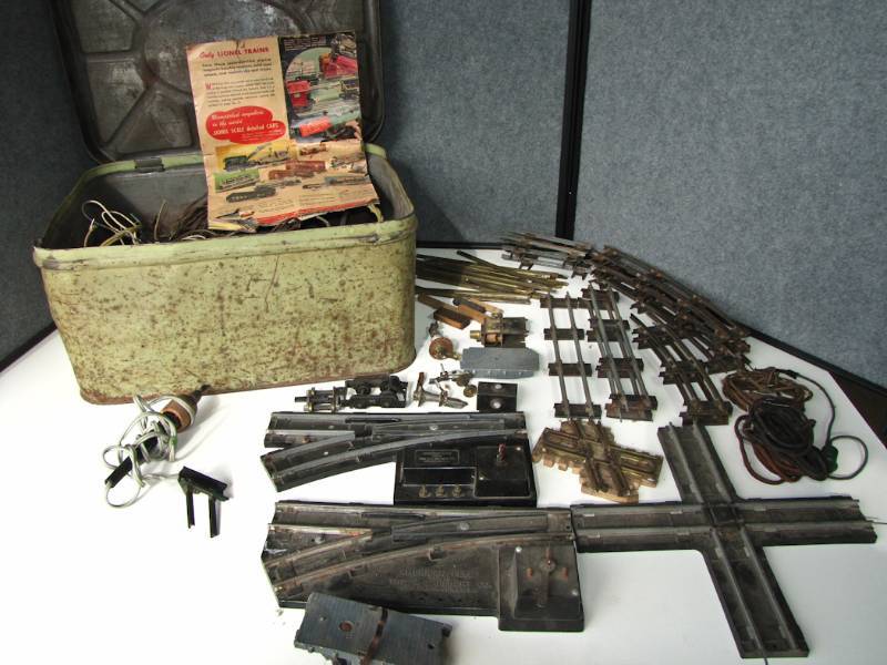 lot 51 image: large tin filled with tracks and more