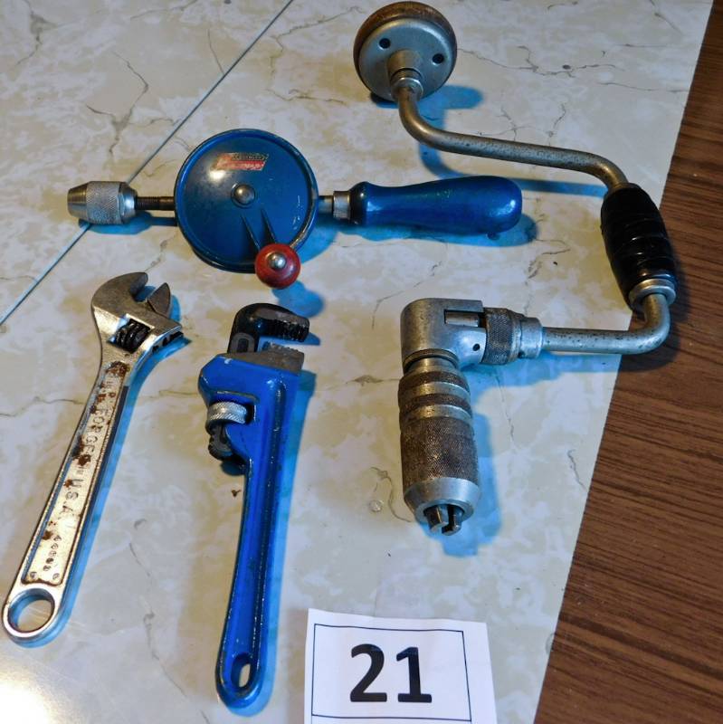 crecent and pipe wrenches and hand drill and brace