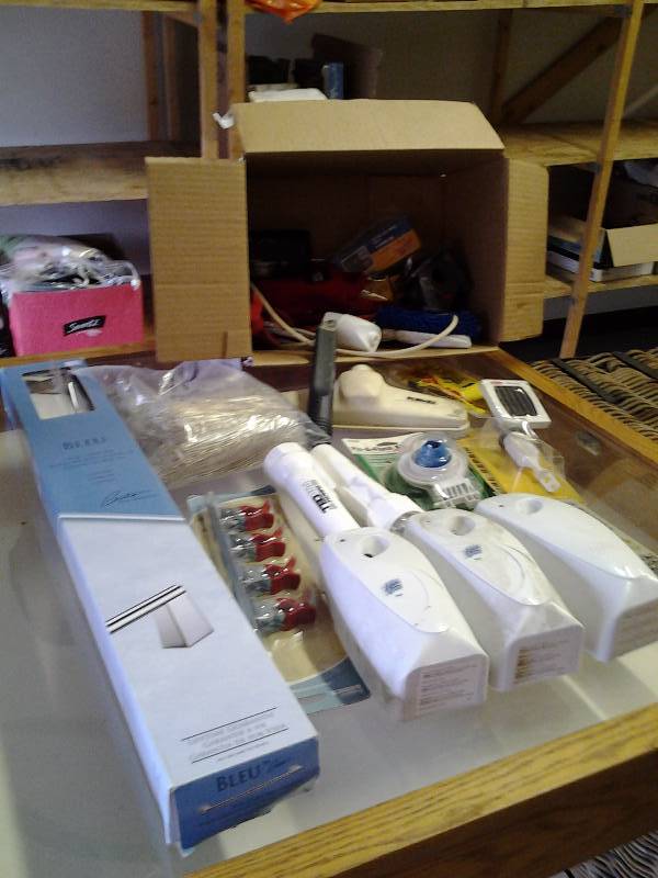 lot 25 image: Box Lot New Towel Bar, Air Freshener Dispensers, Flashlights, Hardware, Vac Attachment