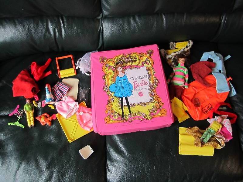 lot 11 image: Vintage Barbie case with clothes, d...