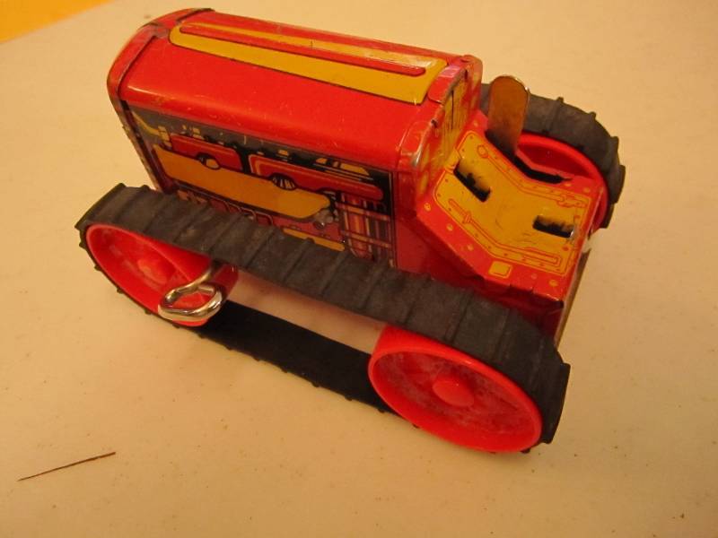 lot 69 image: 1950s wind up tractor, works...