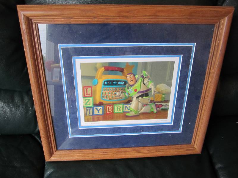 lot 119 image: Buzz to the rescue framed print...
