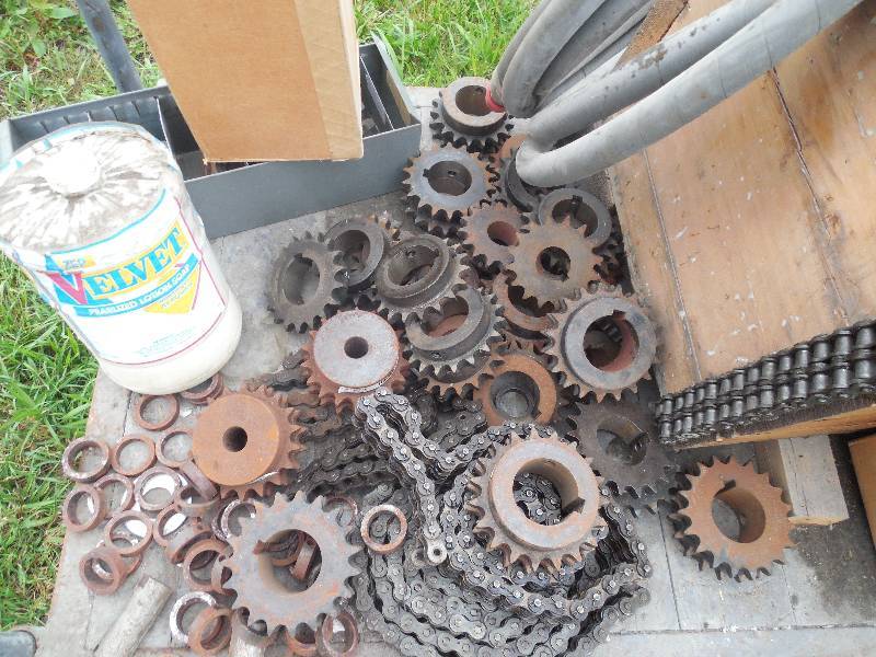 lot 75 image: CART FULL OF SPROCKETS , HOSES, HARDWARE